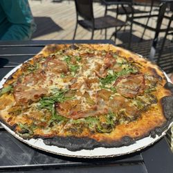 Arugula and prosciuttos brick over pizza