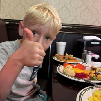 Ocean Buffet - Kid enjoying food - Sushi Bars Near Me - Waco, Texas