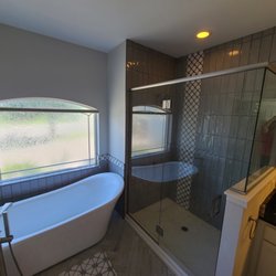 Air-Tight Windows & Remodeling - Tub and shower remodel. Removed a partial wall between shower and vanity to open up the shower, removed a garden tub.
