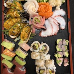 Suehiro Japanese Restaurant & Sushi - Rainbow roll, salmon skin roll, hamachi avocado no rice, dynamite mussels, sashimi