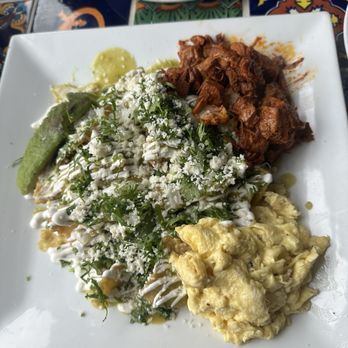 Cafe Xochimilco - Green Sauce Chilaquiles with Eggs and Meat (pastor) - Breakfast & Brunch Near Me - Long Island City, New York Cafe Xochimilco - Green Sauce Chilaquiles with Eggs and Meat (pastor) - Breakfast & Brunch Near Me - Long Island City, New York
