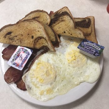 Country Cafe on Main - 2 eggs, bacon and marble rye toast! - American Near Me - Grantsburg, Wisconsin
