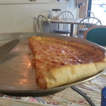 Cc's Pizza - a slice of pizza on a plate - Pizza Near Me - Greybull, Wyoming Cc's Pizza - a slice of pizza on a plate - Pizza Near Me - Greybull, Wyoming