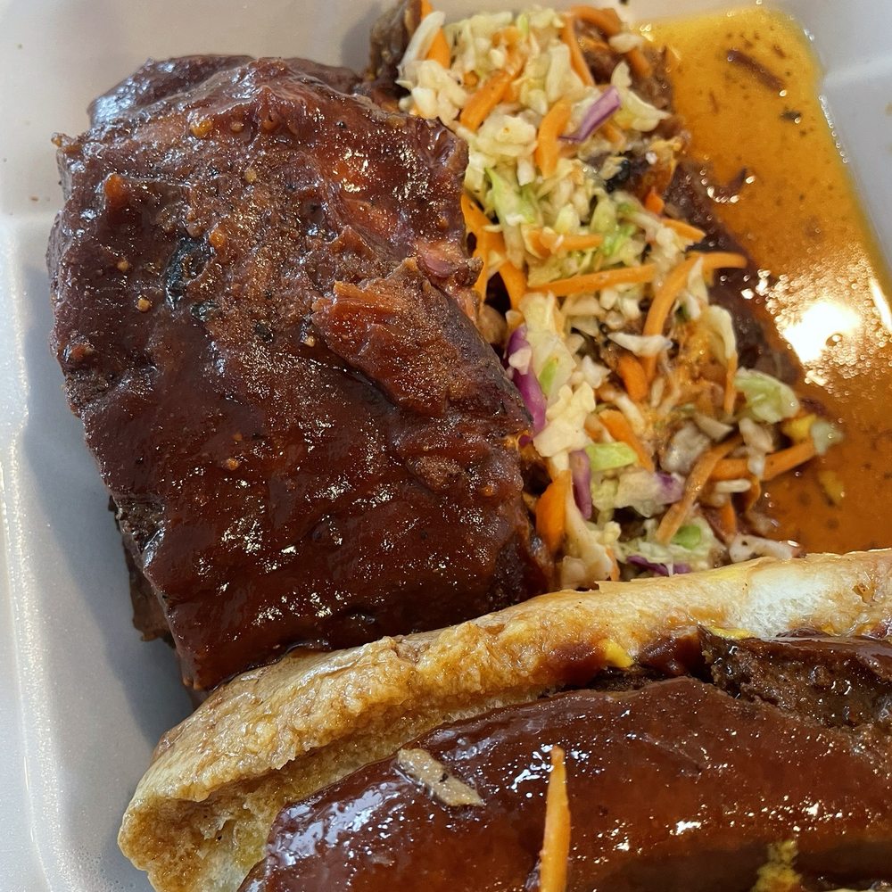 My Rib Joint - Sampler plate- ribs, pulled pork, smoked link on a bun with coleslaw. - Food Trucks Near Me - Vancouver, Washington My Rib Joint - Sampler plate- ribs, pulled pork, smoked link on a bun with coleslaw. - Food Trucks Near Me - Vancouver, Washington