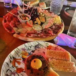 Steak tartar charcuterie and beff carpacio Steak tartar charcuterie and beff carpacio