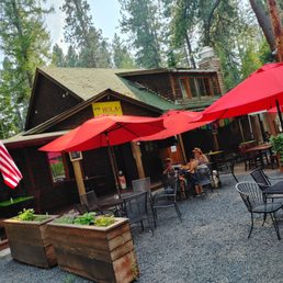 a restaurant with tables and umbrellas
