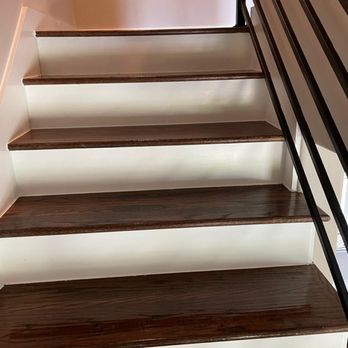 Hector Travieso - a close up of a set of stairs - General Contractors Near Me