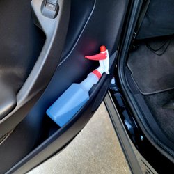 Autobell Car Wash - Their cleaning product, left in the door of my backseat.