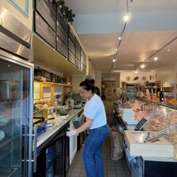 La Fromagerie - Behind the counter with friendly staff