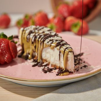 Chocolate Bash - Build Your Own (BYO) cheesecake with dark chocolate and peanut butter drizzle and strawberries - Creperies Near Me - San Diego, California Chocolate Bash - Build Your Own (BYO) cheesecake with dark chocolate and peanut butter drizzle and strawberries - Creperies Near Me - San Diego, California