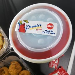 a container of donuts and a container of dipping sauce a container of donuts and a container of dipping sauce