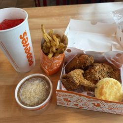 3 piece spicy chicken meal with Cajun fries and red beans and rice.