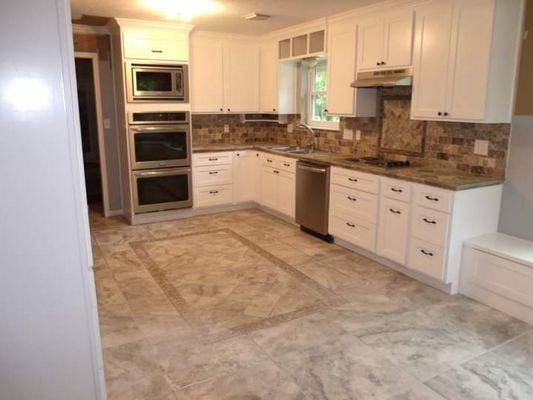 Kitchen Remodel - This was an older kitchen in bad shape.  The cabinets with their custom top and matching backsplash make this project really shine.  Allow us to make your older kitchen look new again!