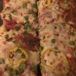Pizza with green peppers, mild peppers, and onions!