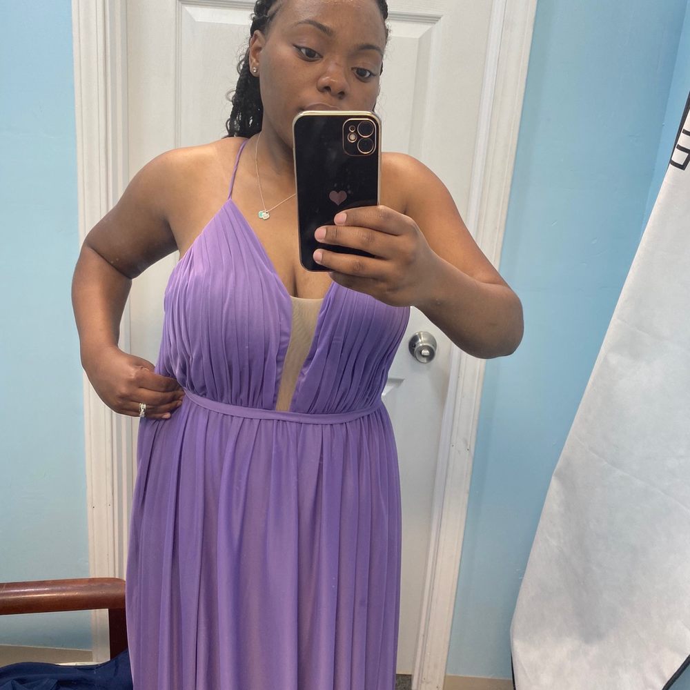 This is AFTER they "altered" the dress. It's still visibly way too big & doesn't fit at all.