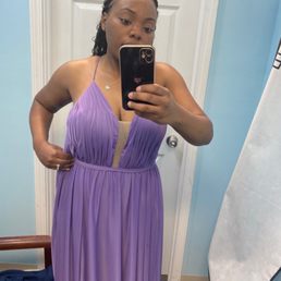 This is AFTER they "altered" the dress. It's still visibly way too big & doesn't fit at all.