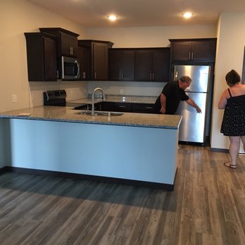 Crossroads at Elm Creek - Nice roomy kitchen with quartz countertops and bright LED lighting - Apartments Near Me - Maple Grove, Minnesota Crossroads at Elm Creek - Nice roomy kitchen with quartz countertops and bright LED lighting - Apartments Near Me - Maple Grove, Minnesota
