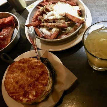 Work & Class - Pictured: ribs, chicken pot pie, green chili fries, and whiskey cocktail - New American Near Me - Denver, Colorado Work & Class - Pictured: ribs, chicken pot pie, green chili fries, and whiskey cocktail - New American Near Me - Denver, Colorado