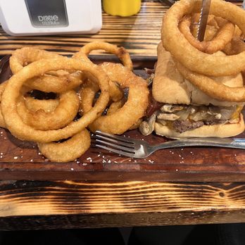 SOB Burgers - The Bitchin burger on a ciabatta bun, sautéed onions, cheddar cheese, bacon and side of onions. - Burgers Near Me - Bradenton, Florida SOB Burgers - The Bitchin burger on a ciabatta bun, sautéed onions, cheddar cheese, bacon and side of onions. - Burgers Near Me - Bradenton, Florida