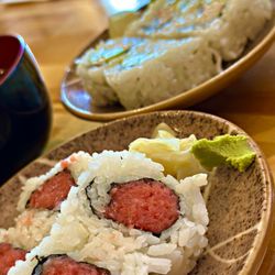 Izakaya Raku - Sushi sides that came with our entree. Spicy sushi and Cali roll. Rice was flavorless, no hint of rice vinegar.