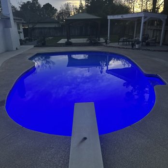Allegiant pool tile cleaning and plastering - Pool with light on - Pressure Washers Near Me - Clovis, California