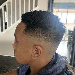 Sharp, clean taper with high fade Sharp, clean taper with high fade