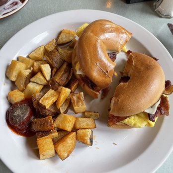 Two Eagles Cafe - Bacon Egg & Cheese Bagel Breakfast Side of Home Fries - Cafes Near Me - Philadelphia, Pennsylvania Two Eagles Cafe - Bacon Egg & Cheese Bagel Breakfast Side of Home Fries - Cafes Near Me - Philadelphia, Pennsylvania