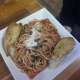 So good, fresh garlic bread, fresh basil and grated parm. The meat sauce was hearty.
