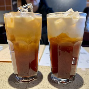 Khao Hom - Thai tea with oat milk (left) and regular Thai tea (right) - before mixing - Thai Near Me - Hayward, California