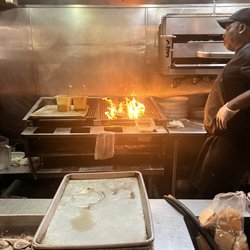 Half Shell Oyster House - Oyster grill man...