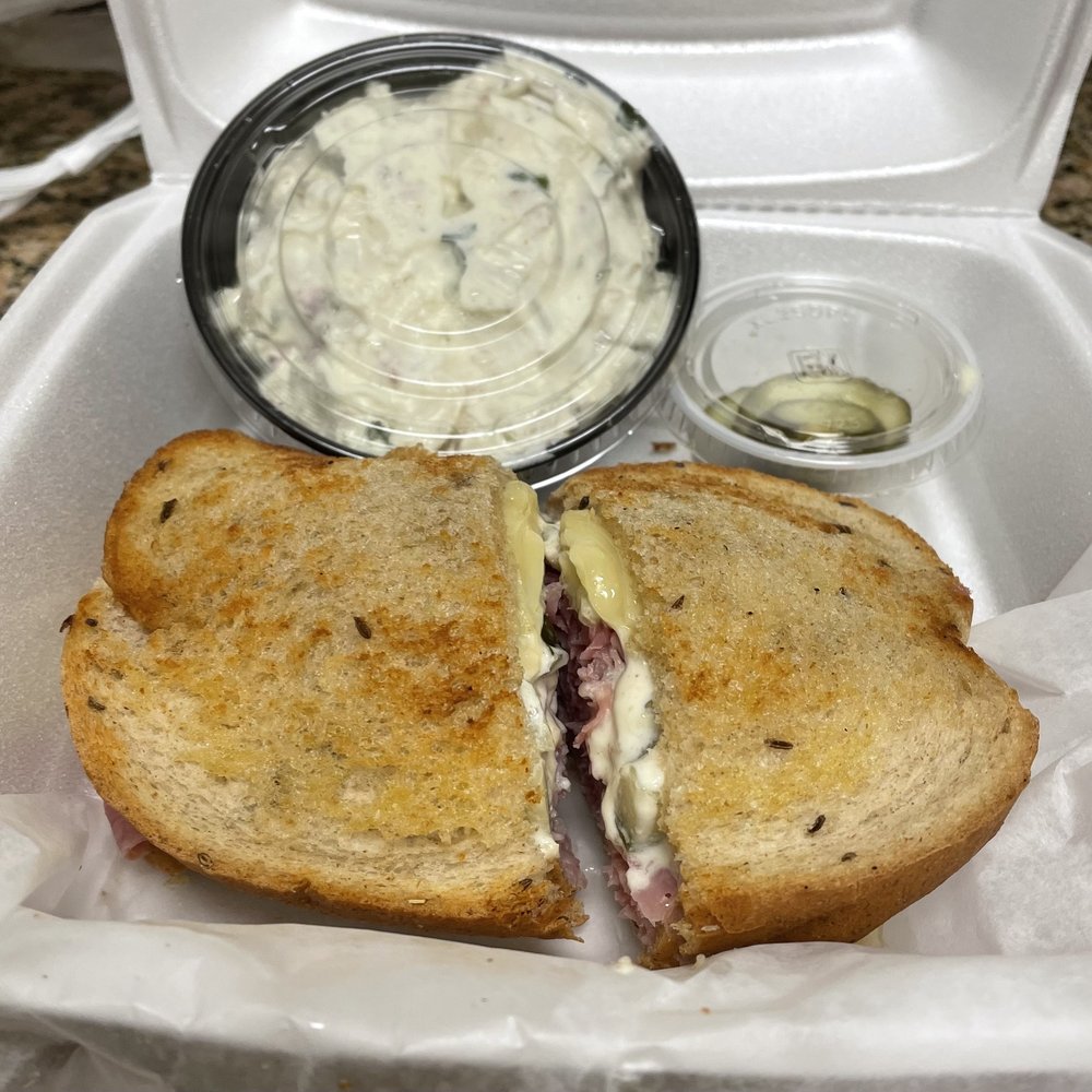 Izzys - Famous Corn-beef and Swiss sandwich with baked potato salad - Sandwiches Near Me - Florence, Kentucky Izzys - Famous Corn-beef and Swiss sandwich with baked potato salad - Sandwiches Near Me - Florence, Kentucky