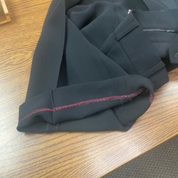 Hoang's Tailoring & Alterations - Red stitching on black pants... why.