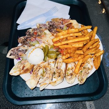 Sultans Mediterranean Grill - This plate features chicken and beef shawarma wraps, sliced and served alongside crispy french fries - Mediterranean Near Me - Bakersfield, California