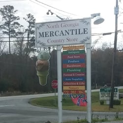 Sign which shows the variety of items sold here. Also note the Confederate battle flag on the bottom. :^\