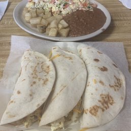 a plate of quesadillas and a plate of potato salad a plate of quesadillas and a plate of potato salad