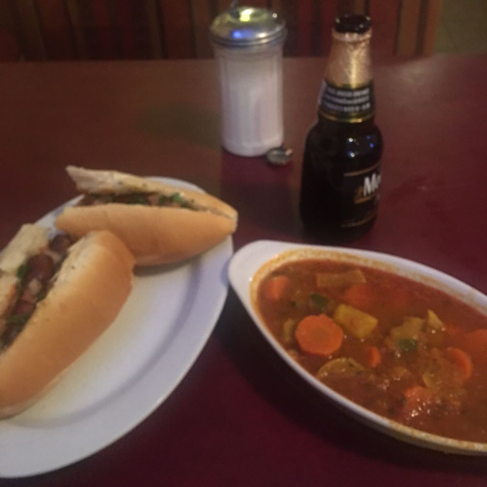 a hot dog and a bowl of soup a hot dog and a bowl of soup