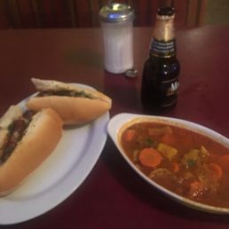 a hot dog and a bowl of soup a hot dog and a bowl of soup