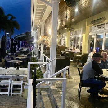 Sailor's Return Restaurant - people sitting at tables outside a restaurant - Seafood Near Me - Stuart, Florida