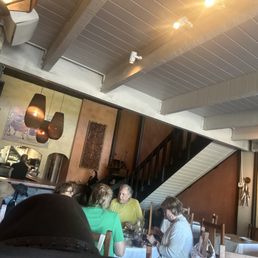 Seated for an early dinner of paella and tapas