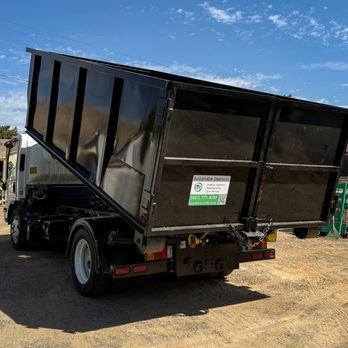 Sustainable Cleanouts - Unloading a 17 yard dumpster from our roll off truck. - Junk Removal & Hauling Near Me Sustainable Cleanouts - Unloading a 17 yard dumpster from our roll off truck. - Junk Removal & Hauling Near Me