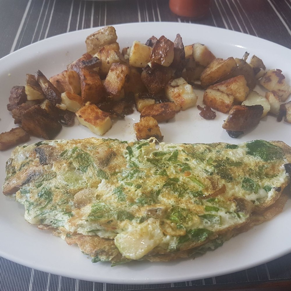 Egg white omelette with mushrooms, onions, bell peppers, feta and mozzarella cheese. Egg white omelette with mushrooms, onions, bell peppers, feta and mozzarella cheese.