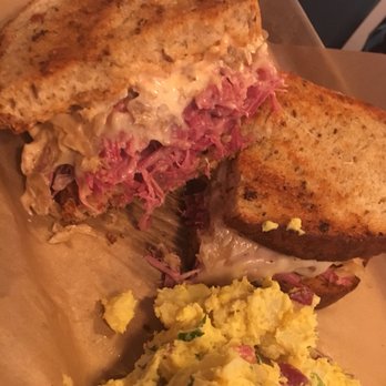 Moto Deli - REUBEN (house-made corned beef, Swiss cheese, sauerkraut, 10,000 island dressing, on grilled rye bread) w/POTATO salad - Sandwiches Near Me - Encinitas, California Moto Deli - REUBEN (house-made corned beef, Swiss cheese, sauerkraut, 10,000 island dressing, on grilled rye bread) w/POTATO salad - Sandwiches Near Me - Encinitas, California