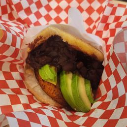 Vegetarian arepa filled with avocado, plantains and black beans Vegetarian arepa filled with avocado, plantains and black beans