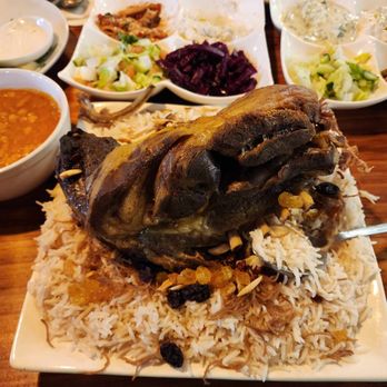 Sumer Nights - Lamb Shank over rice and vermicelli with raisins - Mediterranean Near Me - Sacramento, California Sumer Nights - Lamb Shank over rice and vermicelli with raisins - Mediterranean Near Me - Sacramento, California