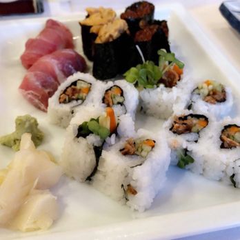 Murata Restaurant - Roll: salmon skin roll Back left: o-toro middle: uni(Chile) right: ikura - Japanese Near Me - Portland, Oregon