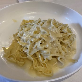 Prossimo Ristorante - Homemade fettuccine pasta with Italian Parmesan cheese wheel sauce - Italian Near Me - Tulsa, Oklahoma Prossimo Ristorante - Homemade fettuccine pasta with Italian Parmesan cheese wheel sauce - Italian Near Me - Tulsa, Oklahoma