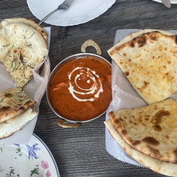 Aama's Kitchen - Butter Chicken, Garlic Naan (left), Cheese Naan (right) - Himalayan/Nepalese Near Me - Hayward, California Aama's Kitchen - Butter Chicken, Garlic Naan (left), Cheese Naan (right) - Himalayan/Nepalese Near Me - Hayward, California