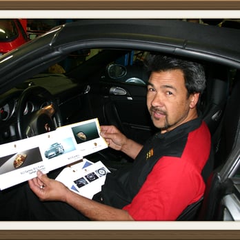 Modderman Service - A quick check: David refers to the owners manual to assist a customer with a question about his car's "bells and whistles." - Auto Repair Near Me - Mountain View, California