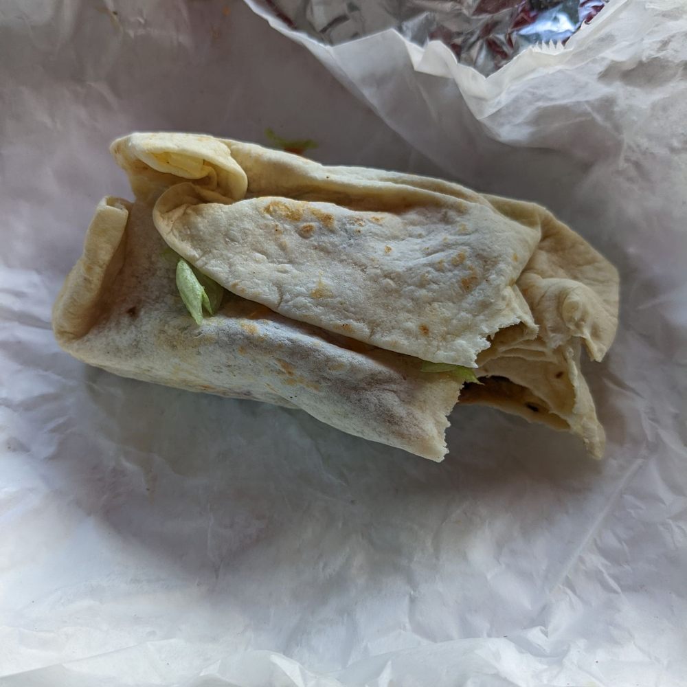 El Nopal - This is their carne asada burrito. It was fine. But it's not wrapped right. - Mexican Near Me - Dover, Delaware El Nopal - This is their carne asada burrito. It was fine. But it's not wrapped right. - Mexican Near Me - Dover, Delaware