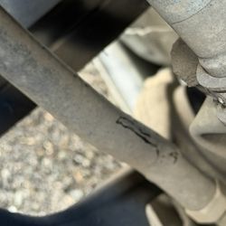 Airport Towing - Bent tie rod with contact markings consistent with sliding /force on the side facing the street where they towed my vehicle.